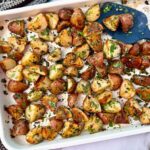 roasted potatoes on a white baking sheet