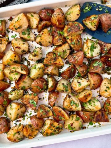 roasted potatoes on a white baking sheet