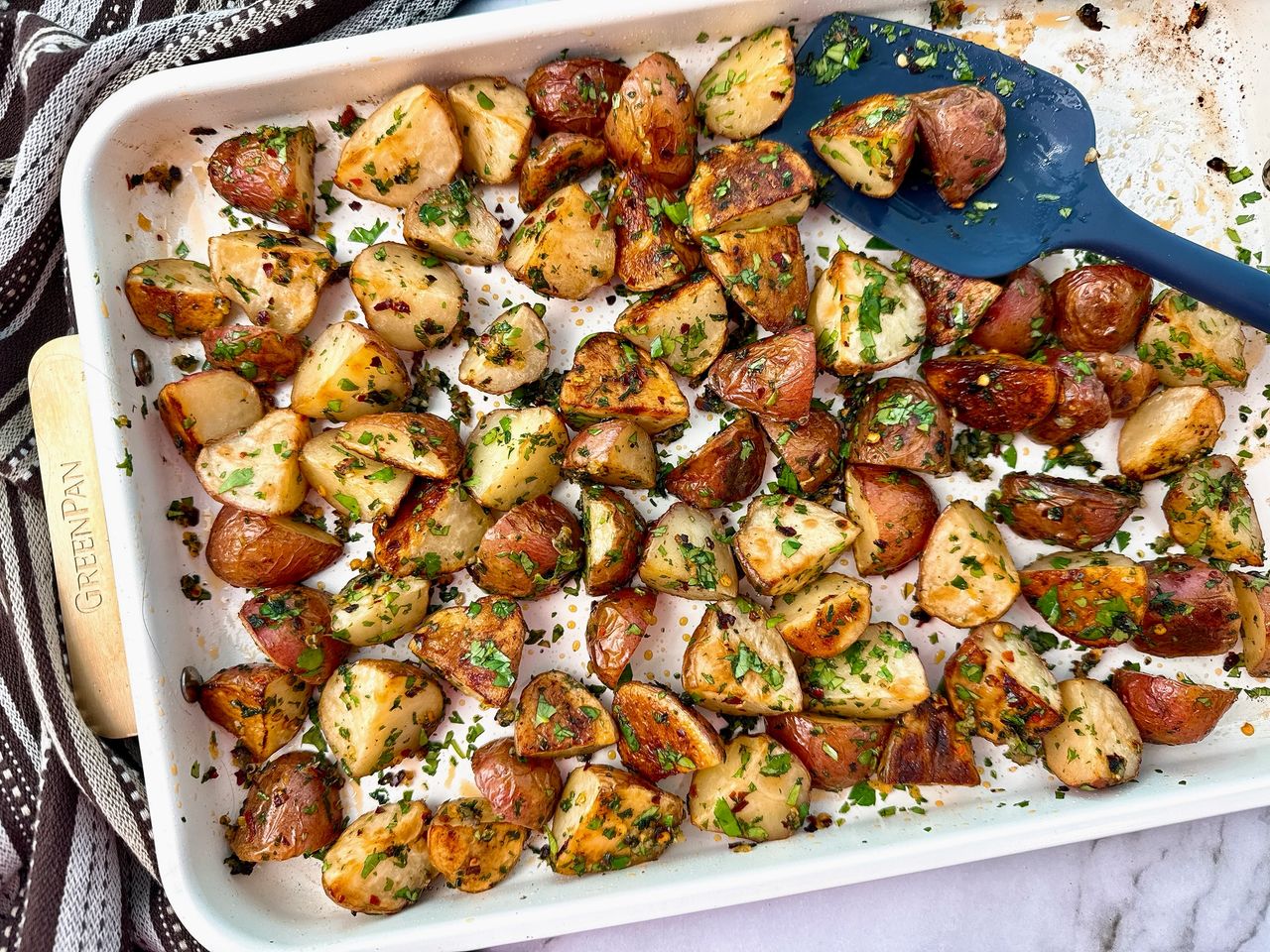 roasted potatoes on a white baking sheet