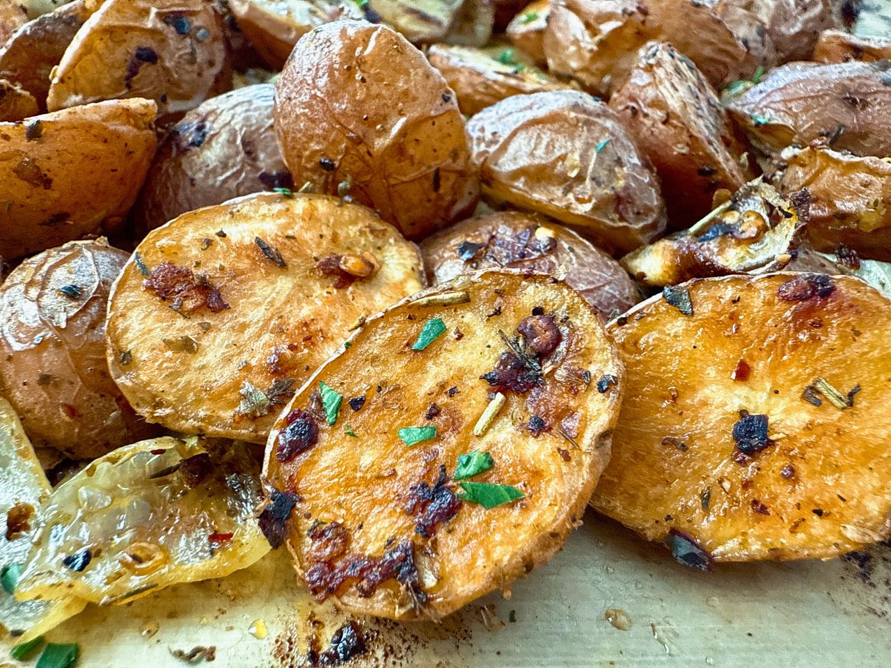 Garlic Roasted Potatoes and Onions garlic roasted potatoes and onions on a baking sheet