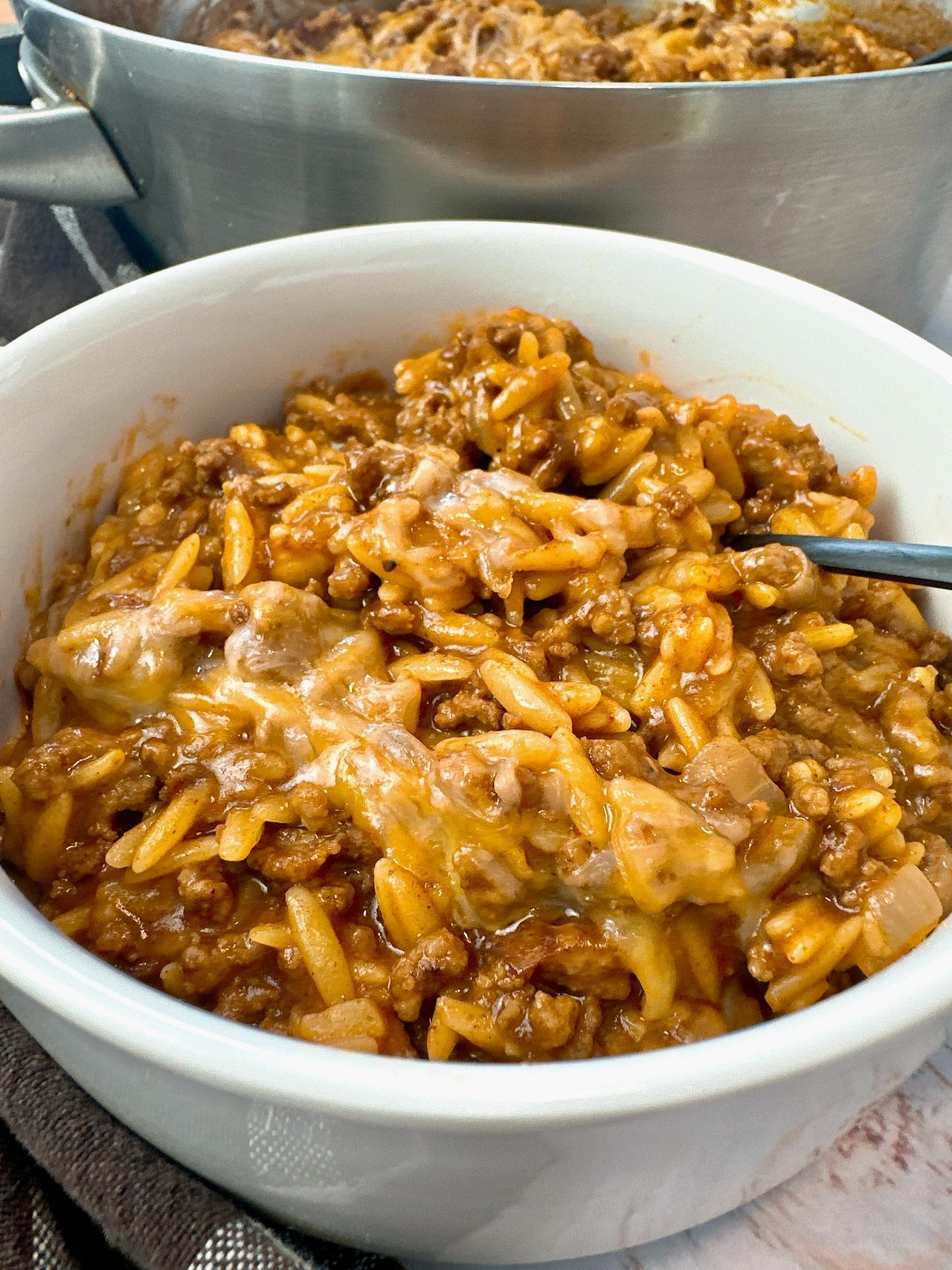 ground beef and pasta in a white bowl