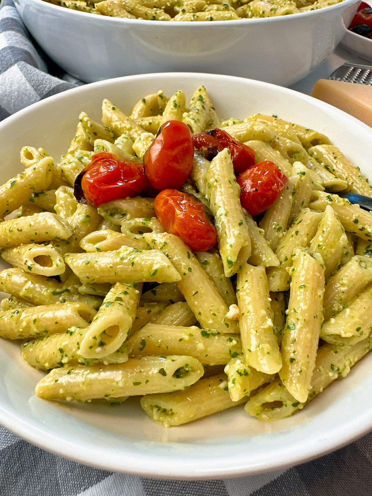 penne pasta with pesto and blistered tomatoes