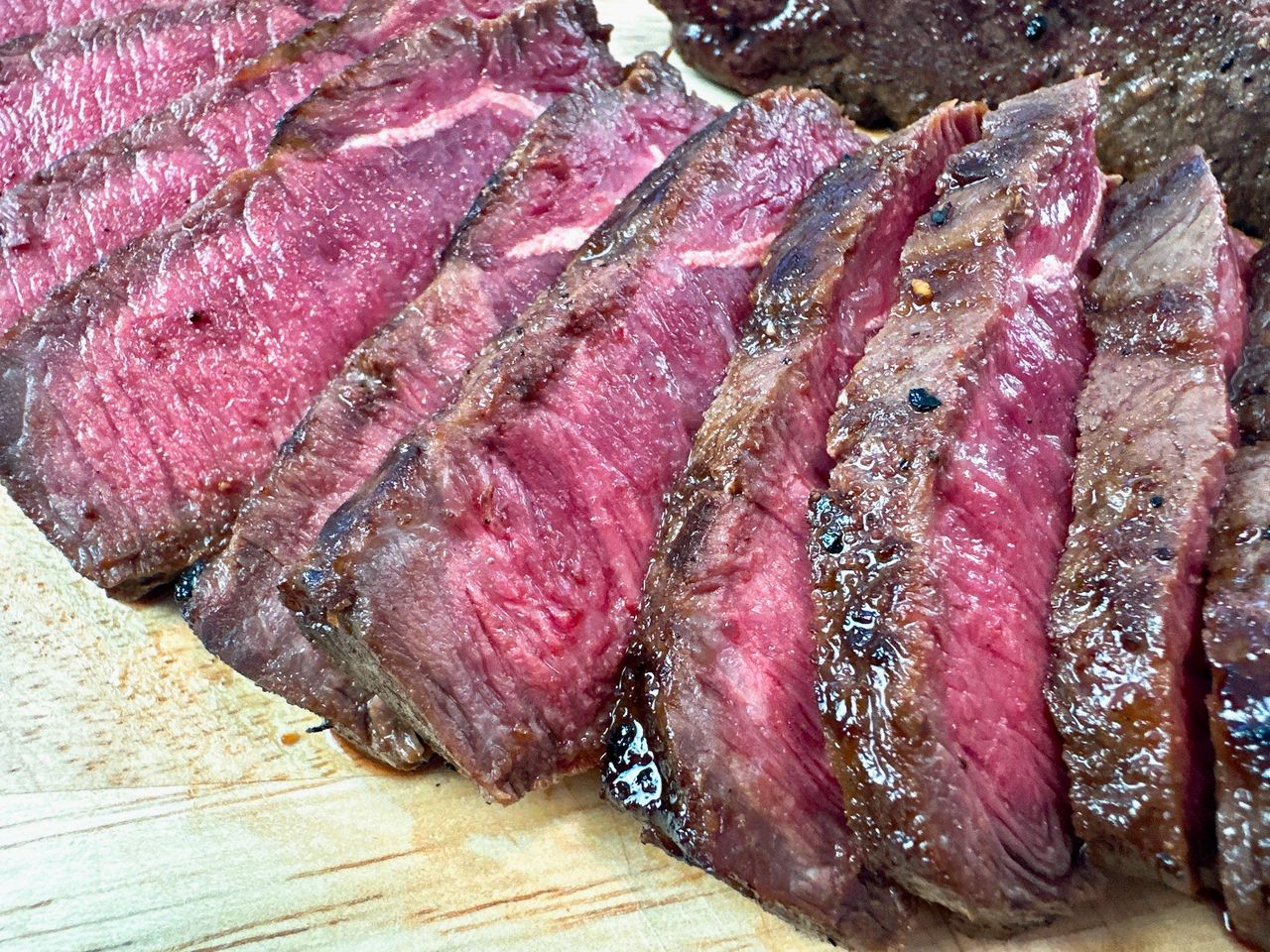 sliced steak on a cutting board