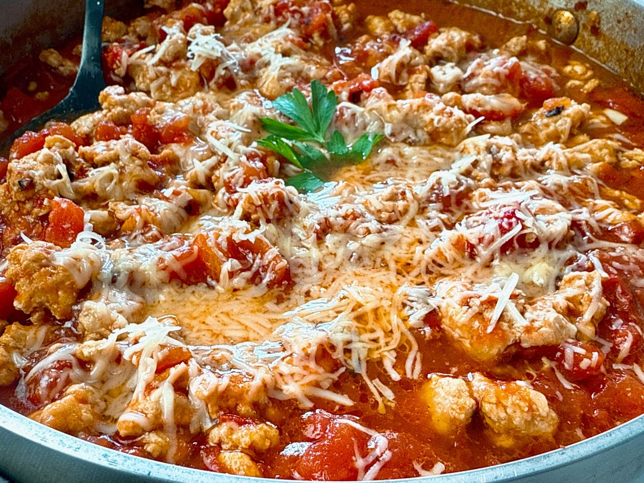 Ground Chicken Arrabbiata ground chicken arrabbiata with cheese in a silver pan