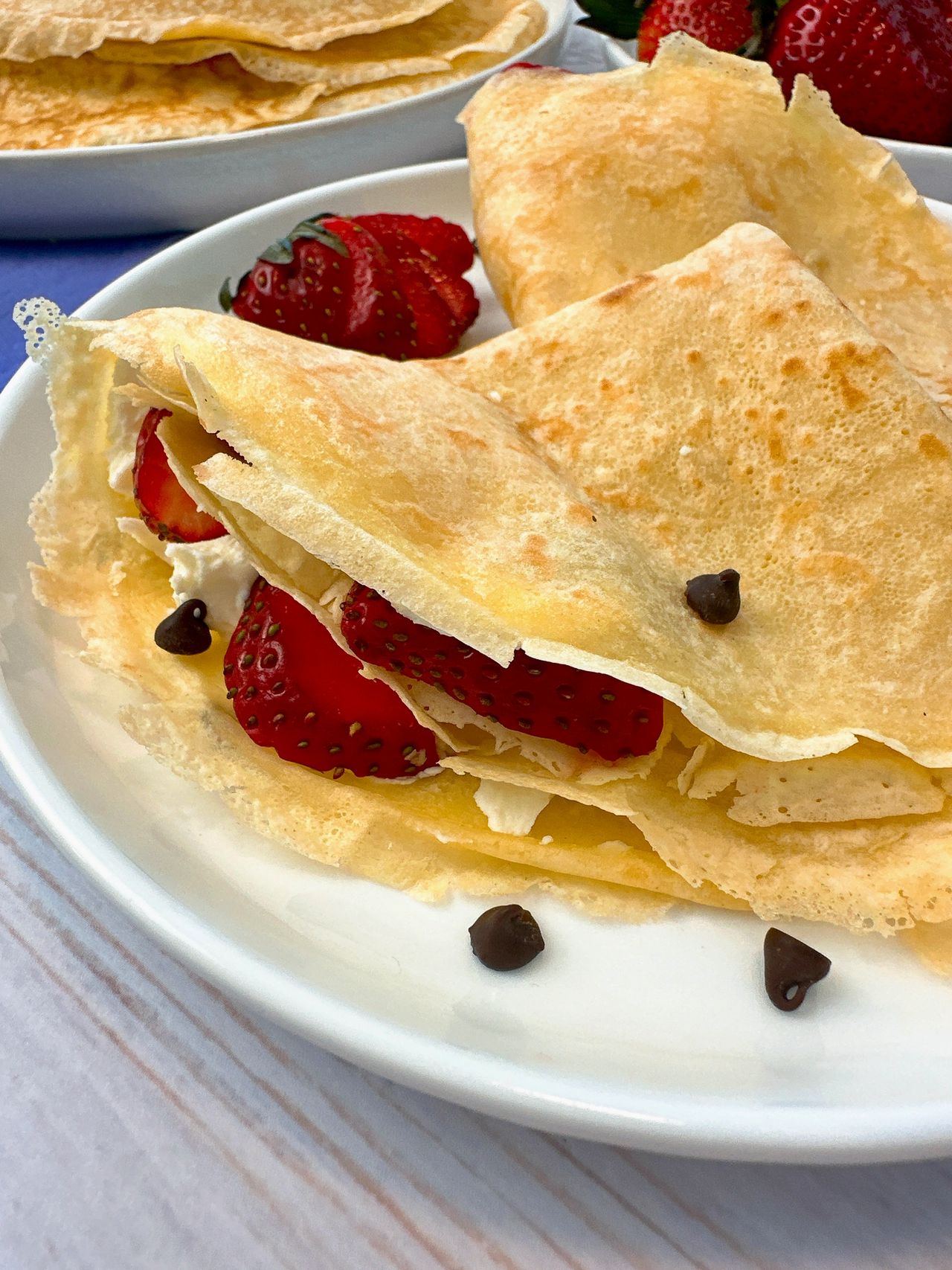 Crepes filled with mascarpone cheese and served with strawberries