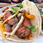 steak street tacos on a white plate