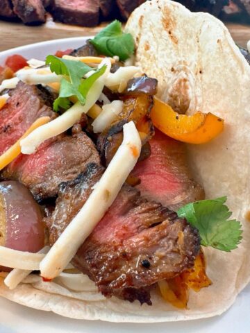 steak street tacos on a white plate