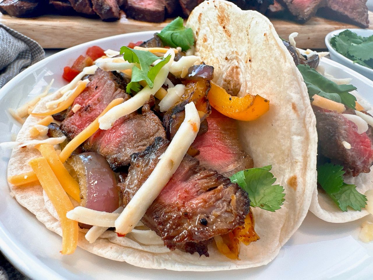 steak street tacos on a white plate
