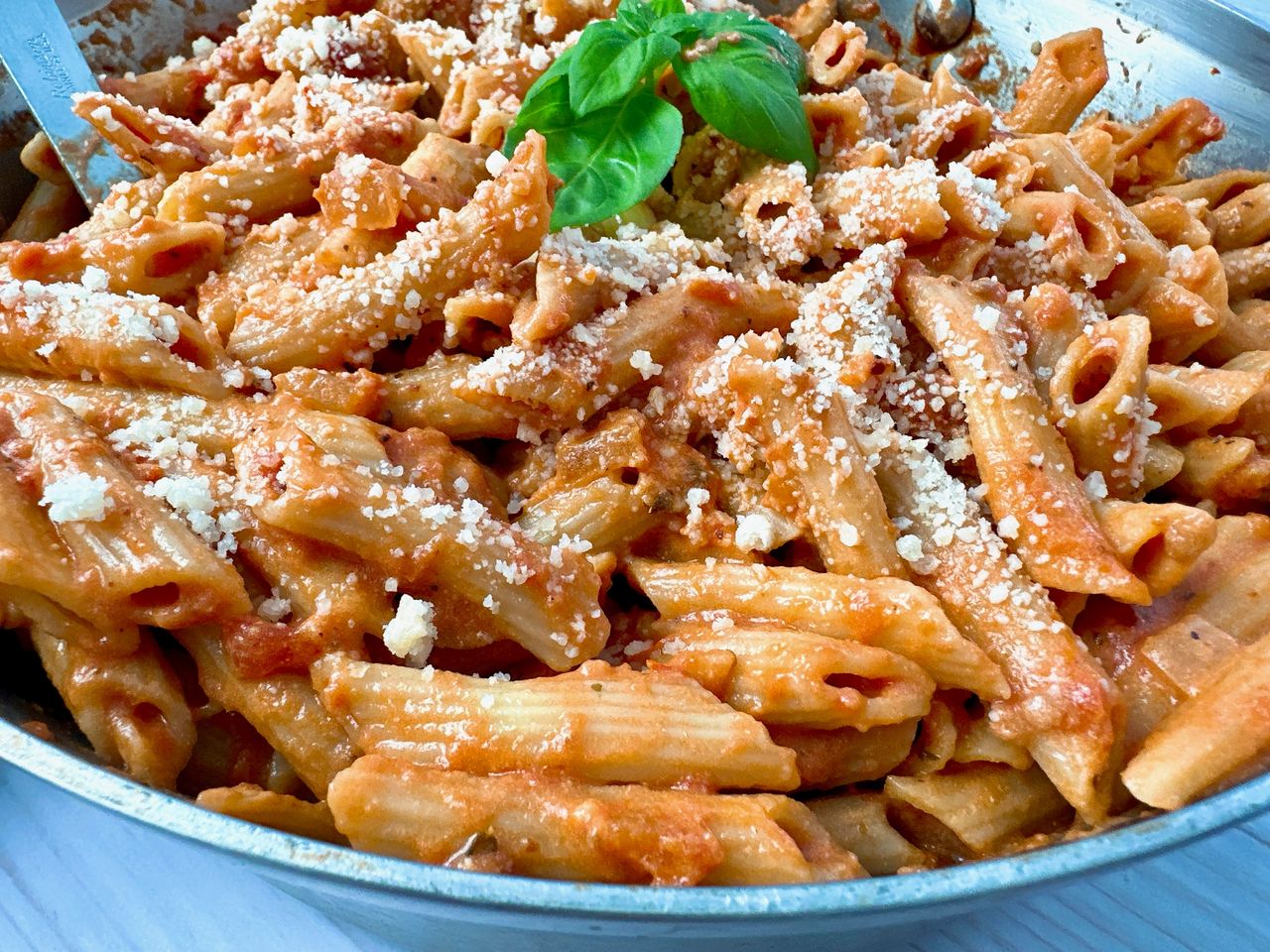pasta in tomato cream sauce in a bowl
