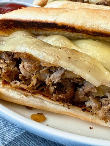 philly cheesesteak on a white plate