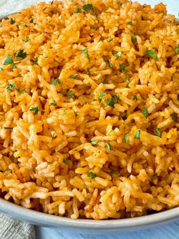 spanish rice in a tan bowl