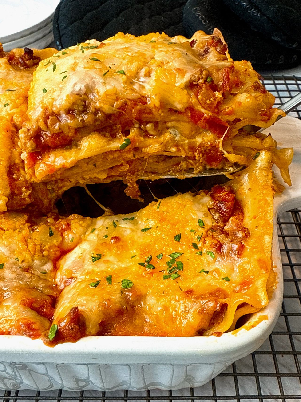 Lasagna lasagna in a white baking dish