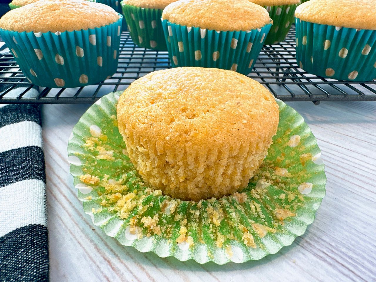 cornbread muffins on a wire rack and white counter