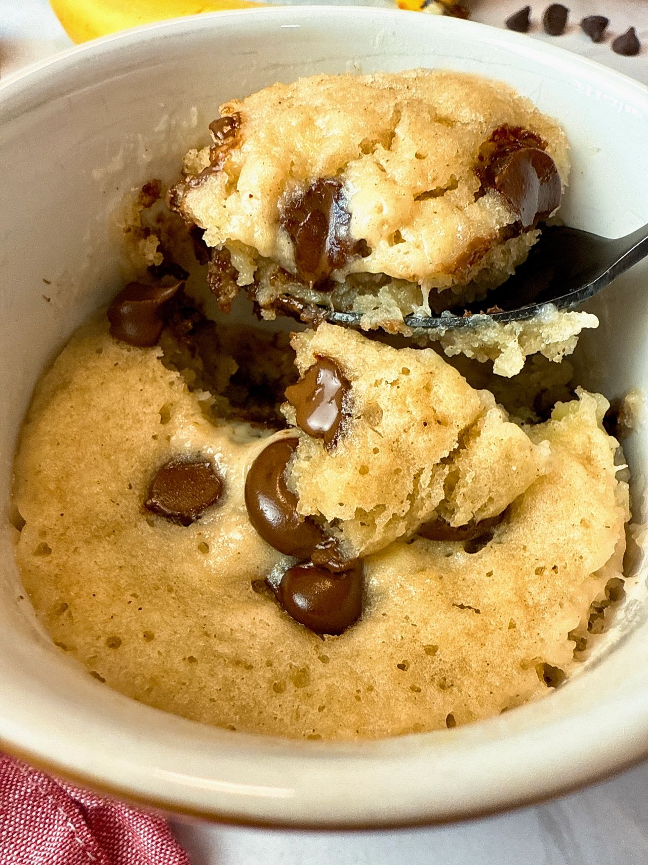 Banana Bread Mug Cake chocolate chip banana bread mug cake with a spoon