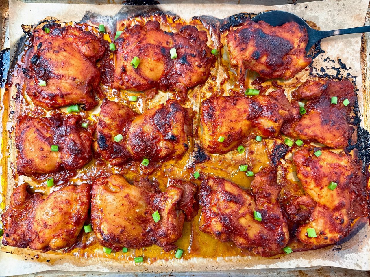 gochujang chicken thighs on a sheet pan