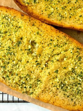 garlic bread on parchment paper