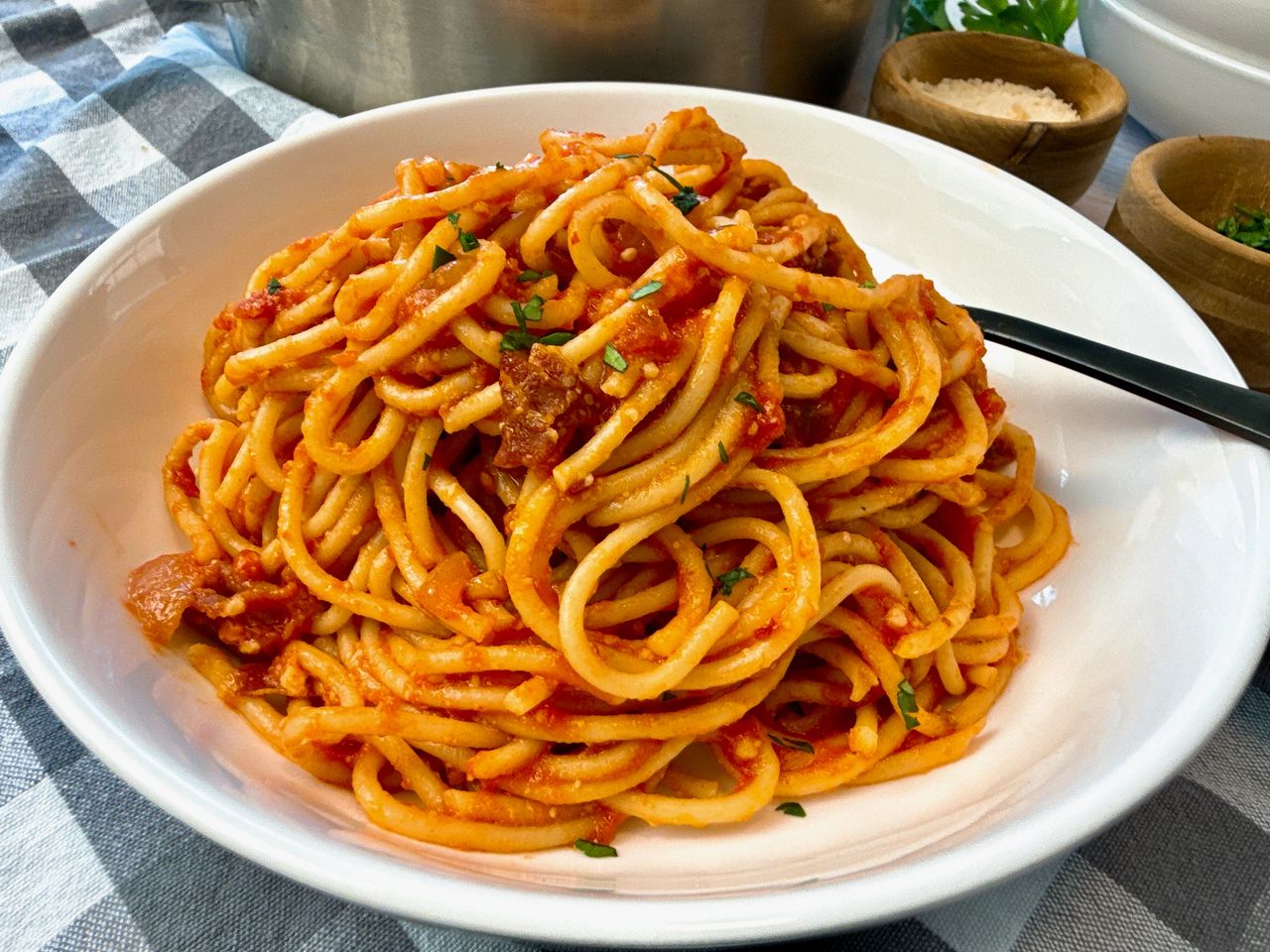 pasta amatriciana in a white bowl