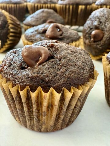mini chocolate banana muffins on a white surface