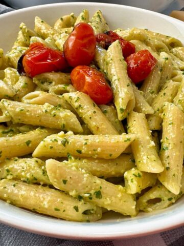 penne pasta with pesto and blistered tomatoes