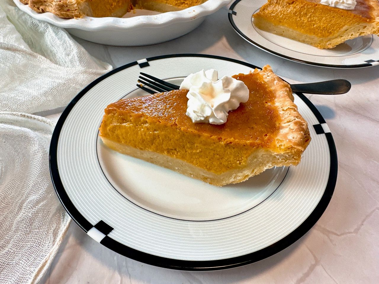 slice of pumpkin pie on a plate