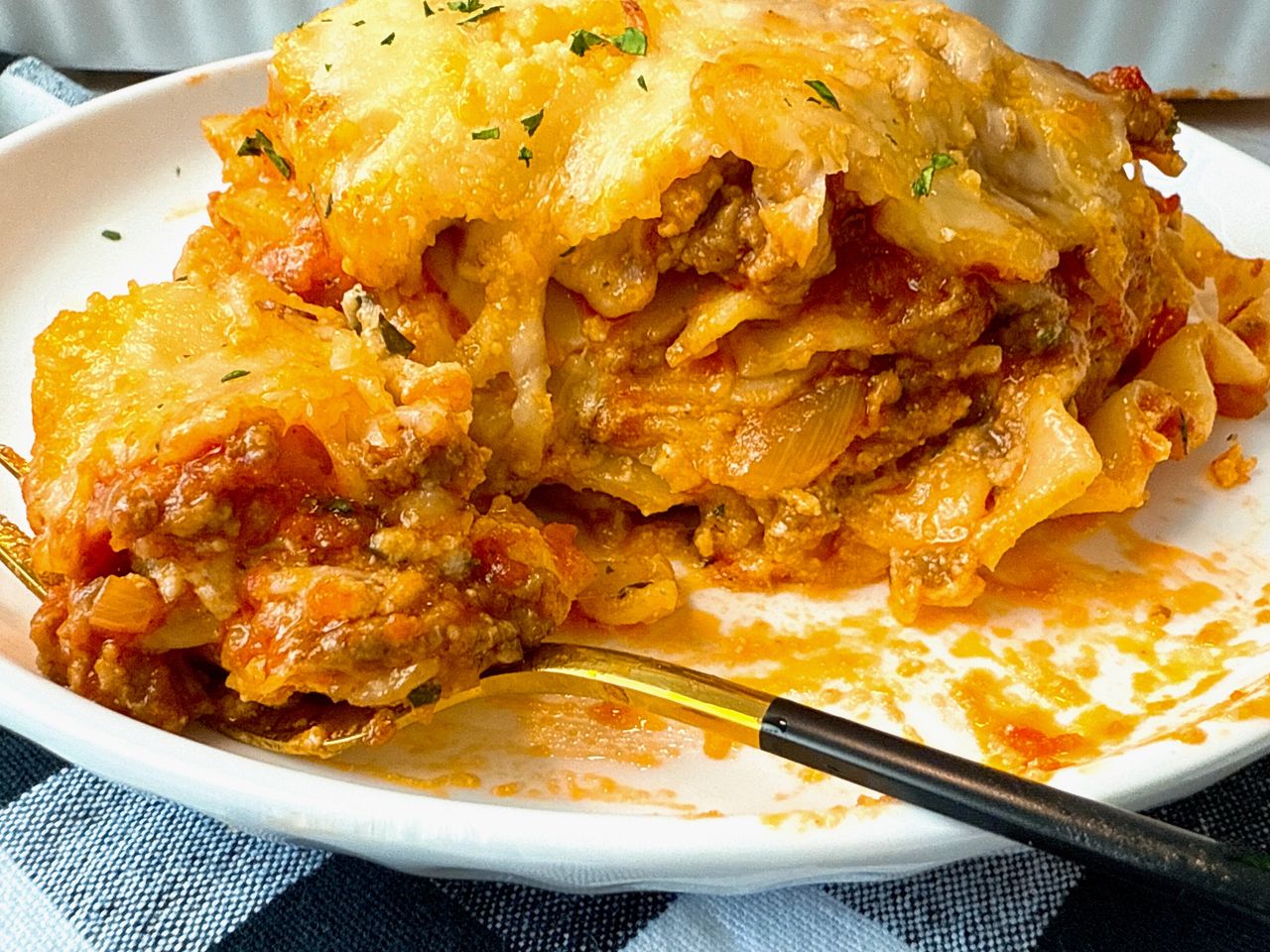 slice of lasagna on a white plate