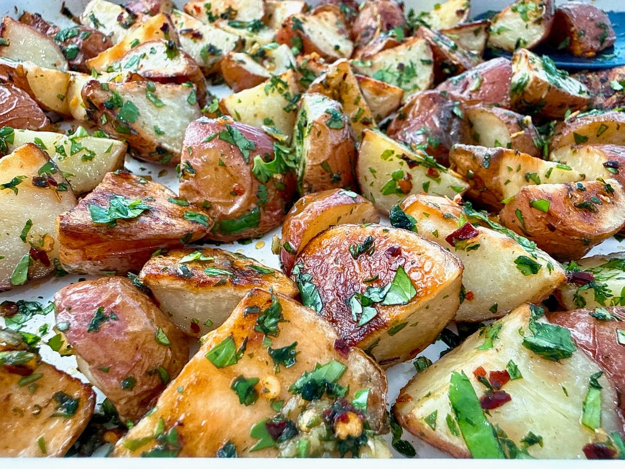 roasted potatoes on a white baking sheet