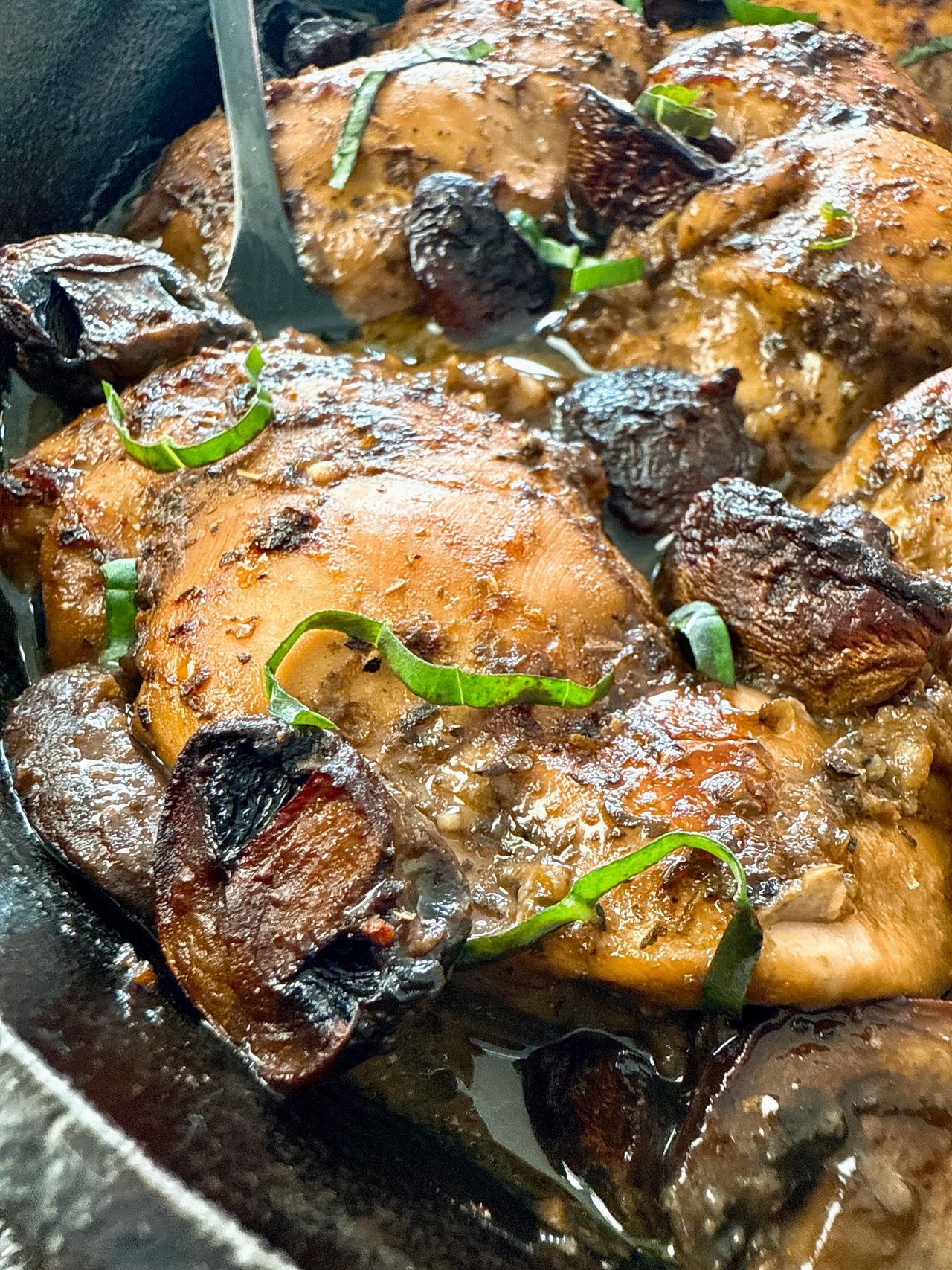 balsamic chicken and mushrooms in a cast iron skillet