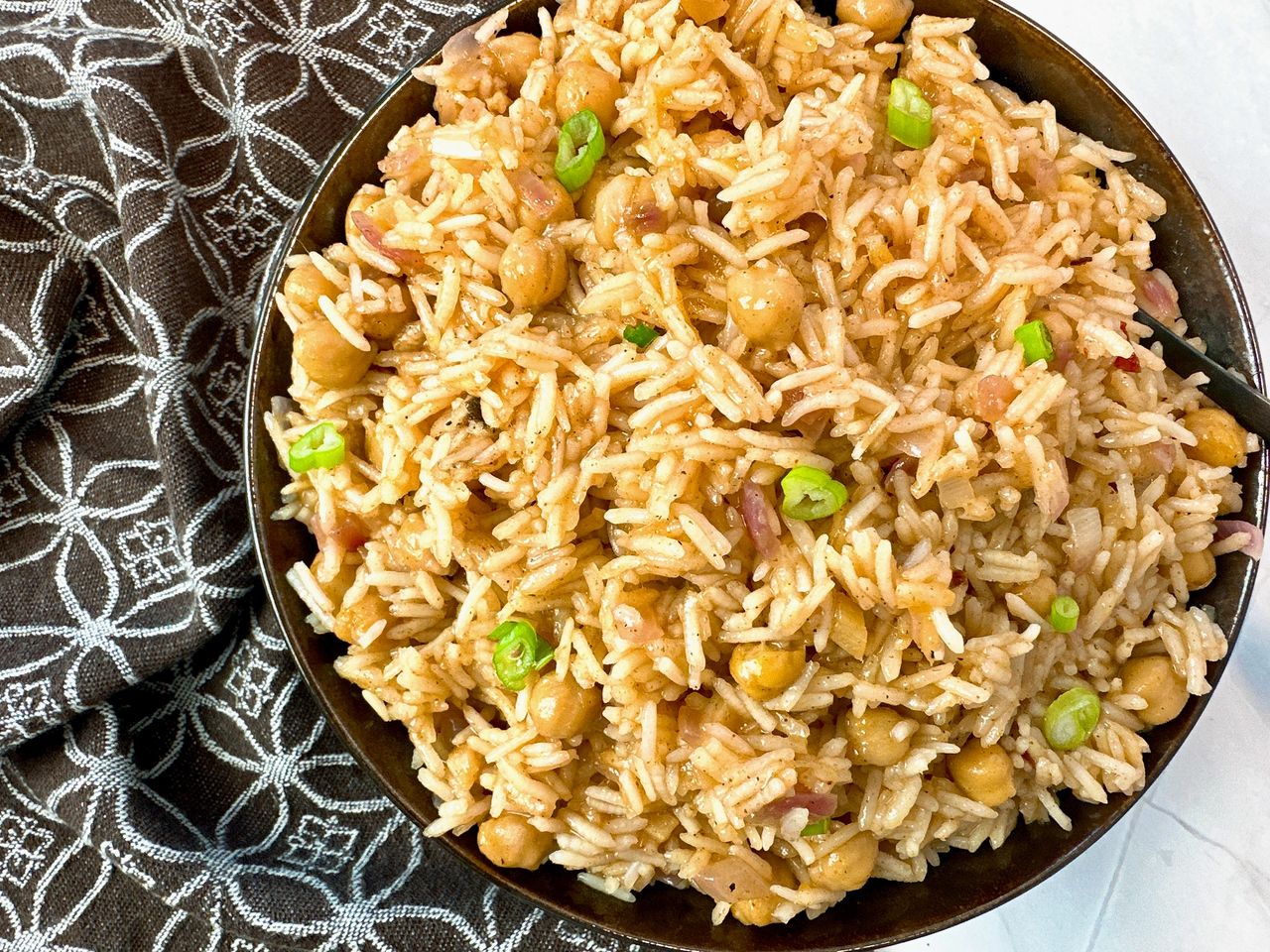 mango rice in a brown bowl