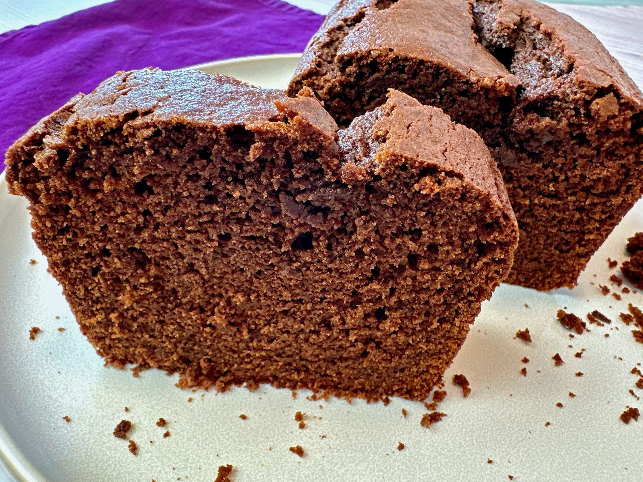chocolate loaf cake slices on a white plate
