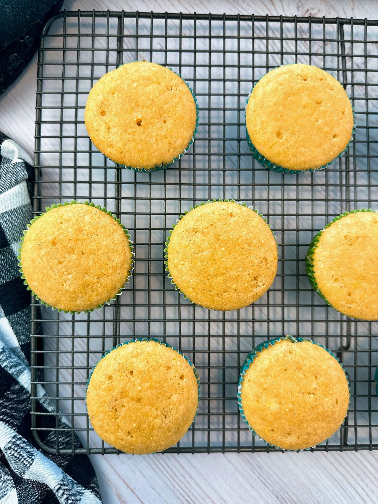 cornbread muffins on a wire rack and white counter