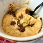 chocolate chip banana bread mug cake with a spoon
