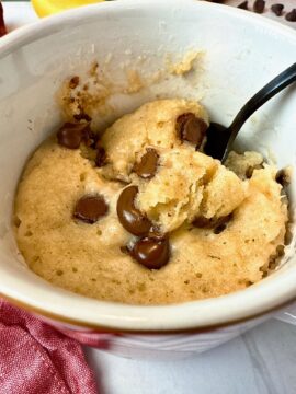 chocolate chip banana bread mug cake with a spoon