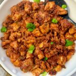 gochujang chicken in a white skillet