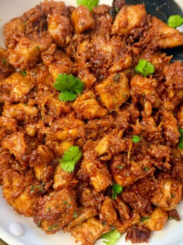 gochujang chicken in a white skillet