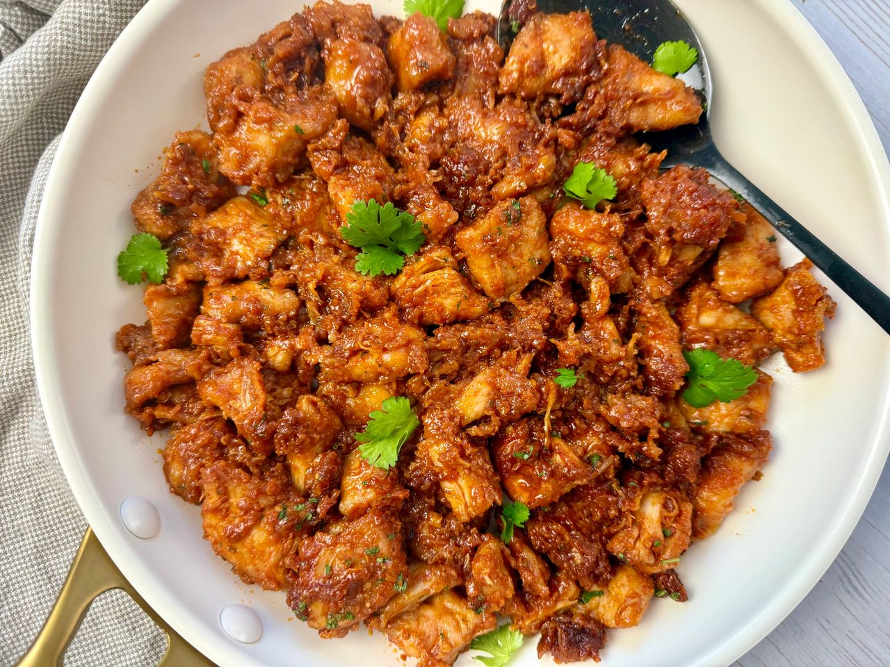 gochujang chicken in a white skillet