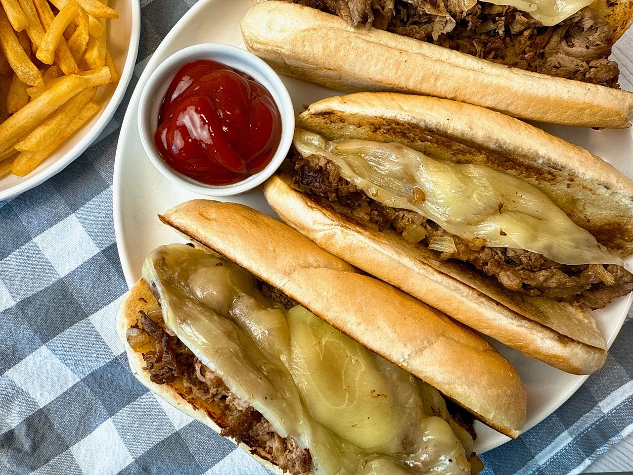 philly cheesesteak on a white plate