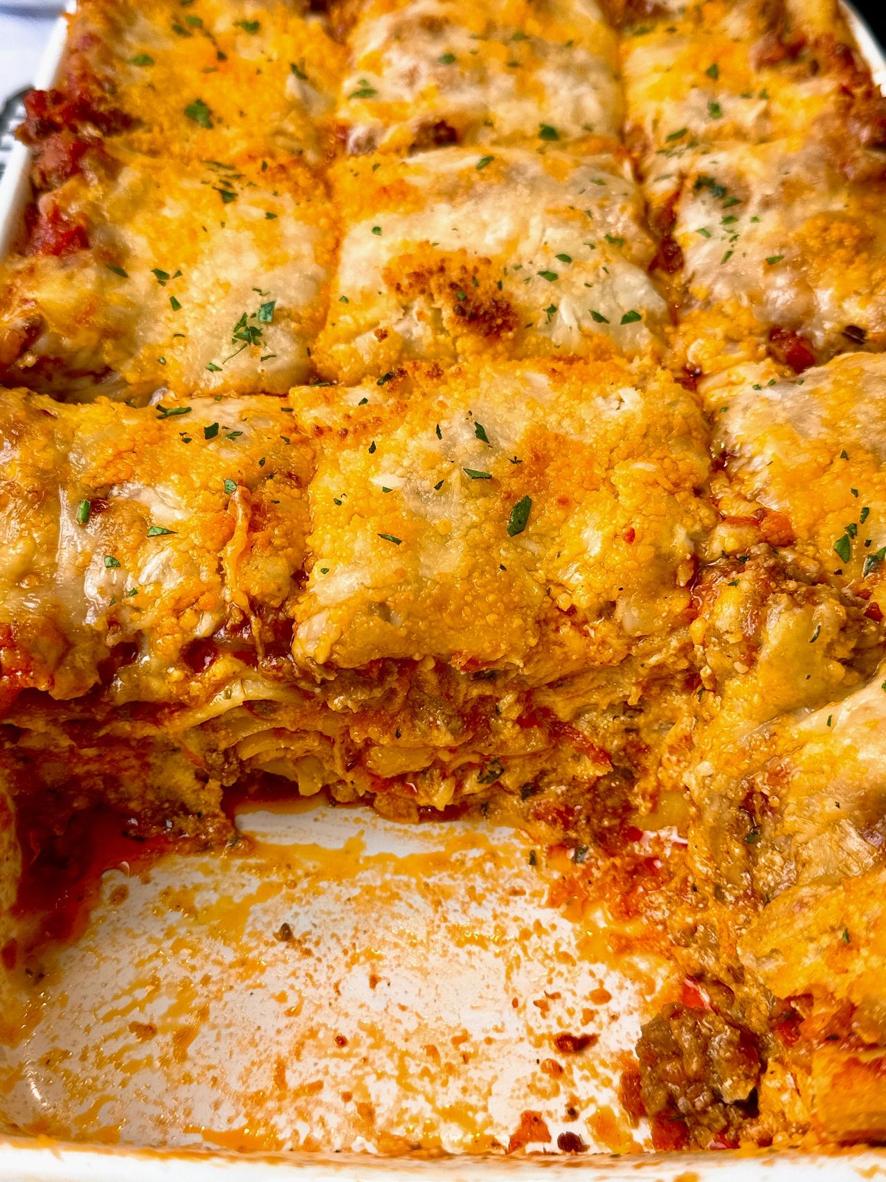 lasagna in a white baking dish