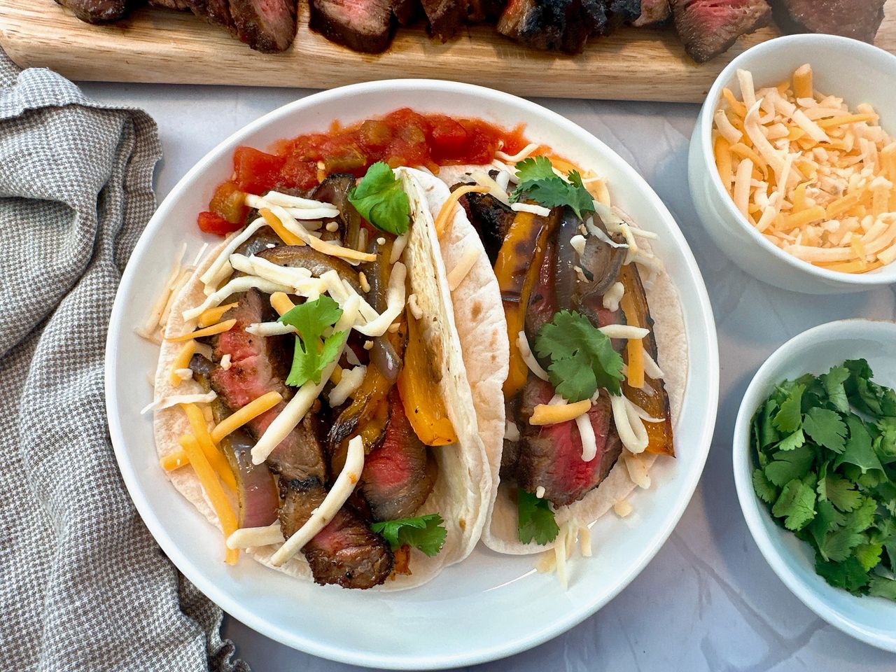 steak street tacos on a white plate