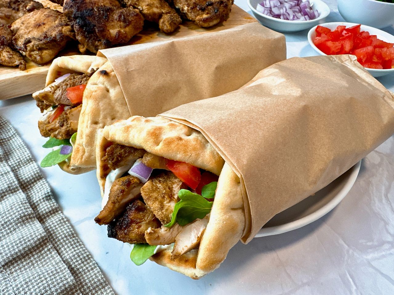 chicken shawarma wraps on a white plate