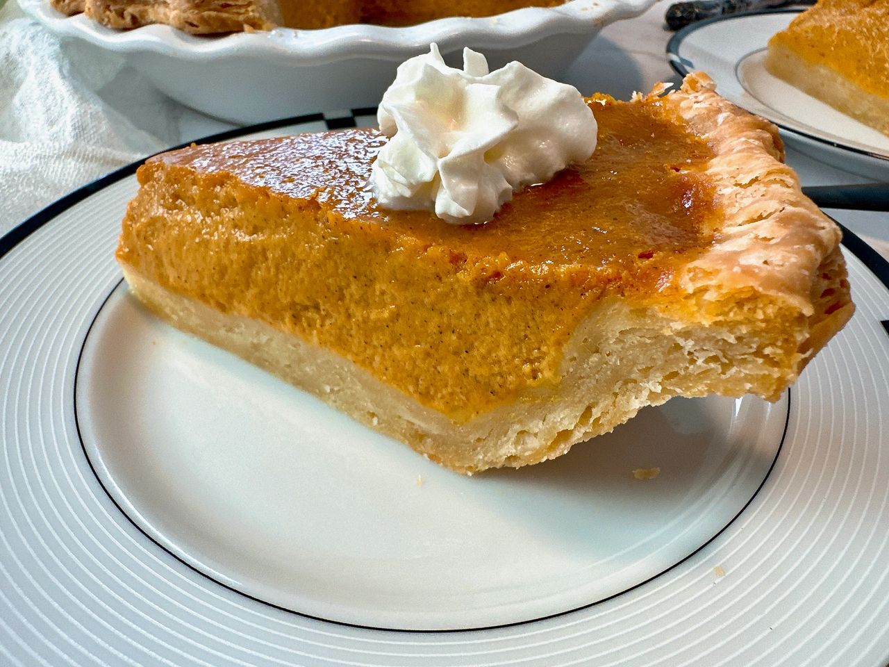 slice of pumpkin pie on a plate