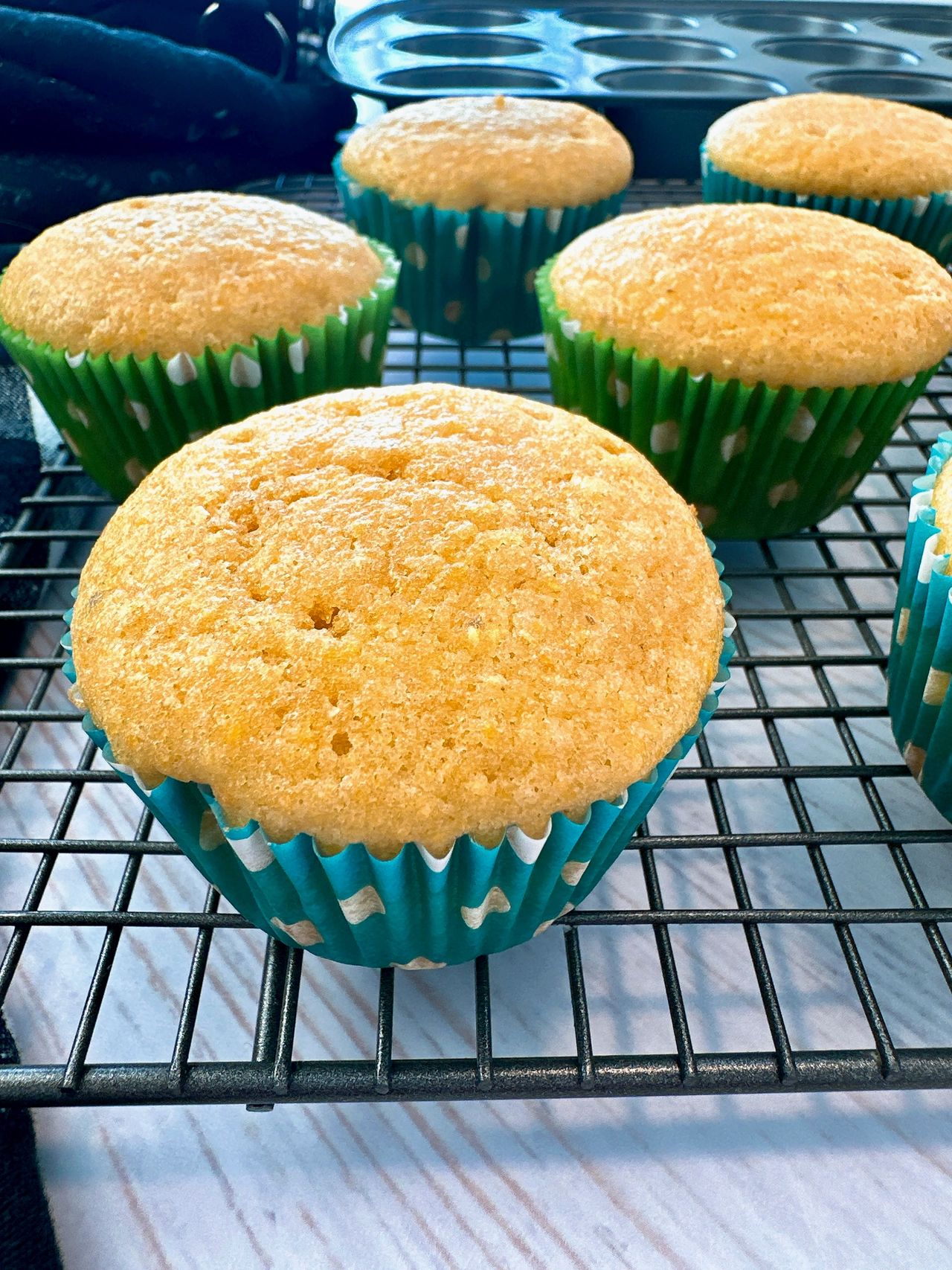 cornbread muffins on a wire rack and white counter
