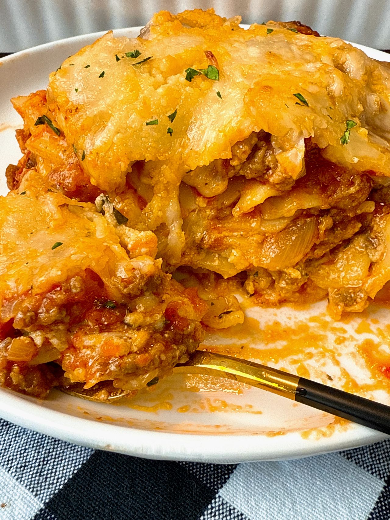 slice of lasagna on a white plate