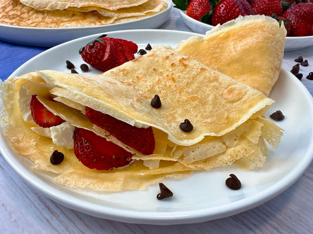 Crepes filled with mascarpone cheese and served with strawberries