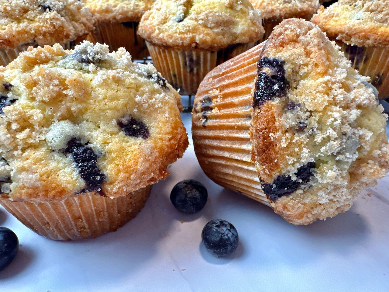 blueberry muffins on a white counter