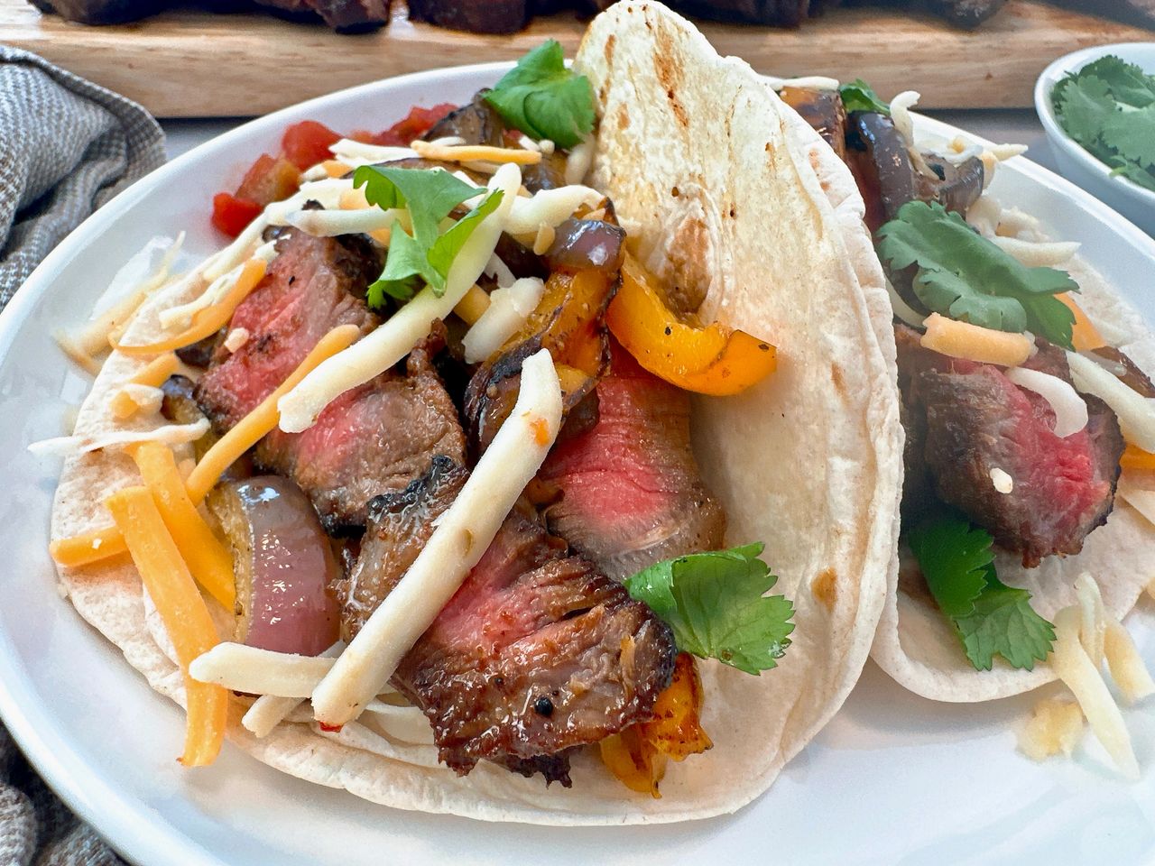 steak street tacos on a white plate