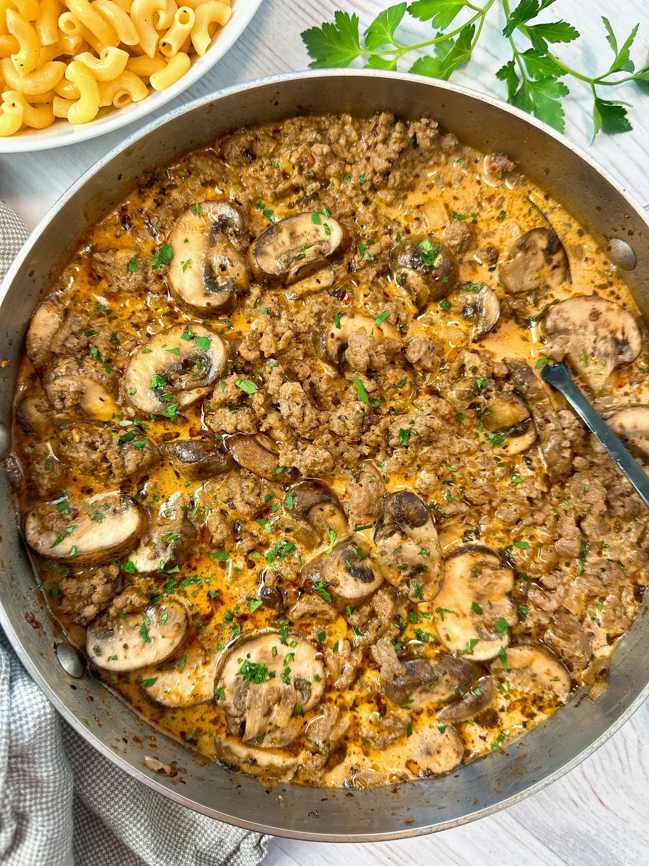 ground beef and mushrooms in a skillet