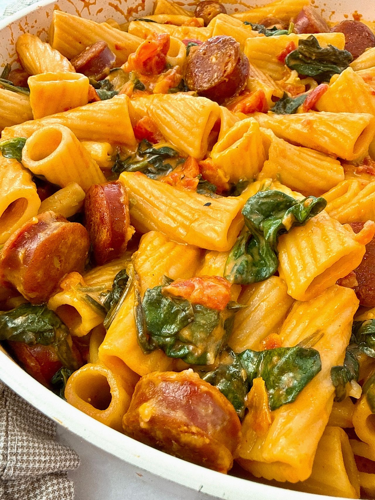 rigatoni with chorizo in a white skillet