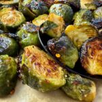roasted brussels sprouts on parchment paper