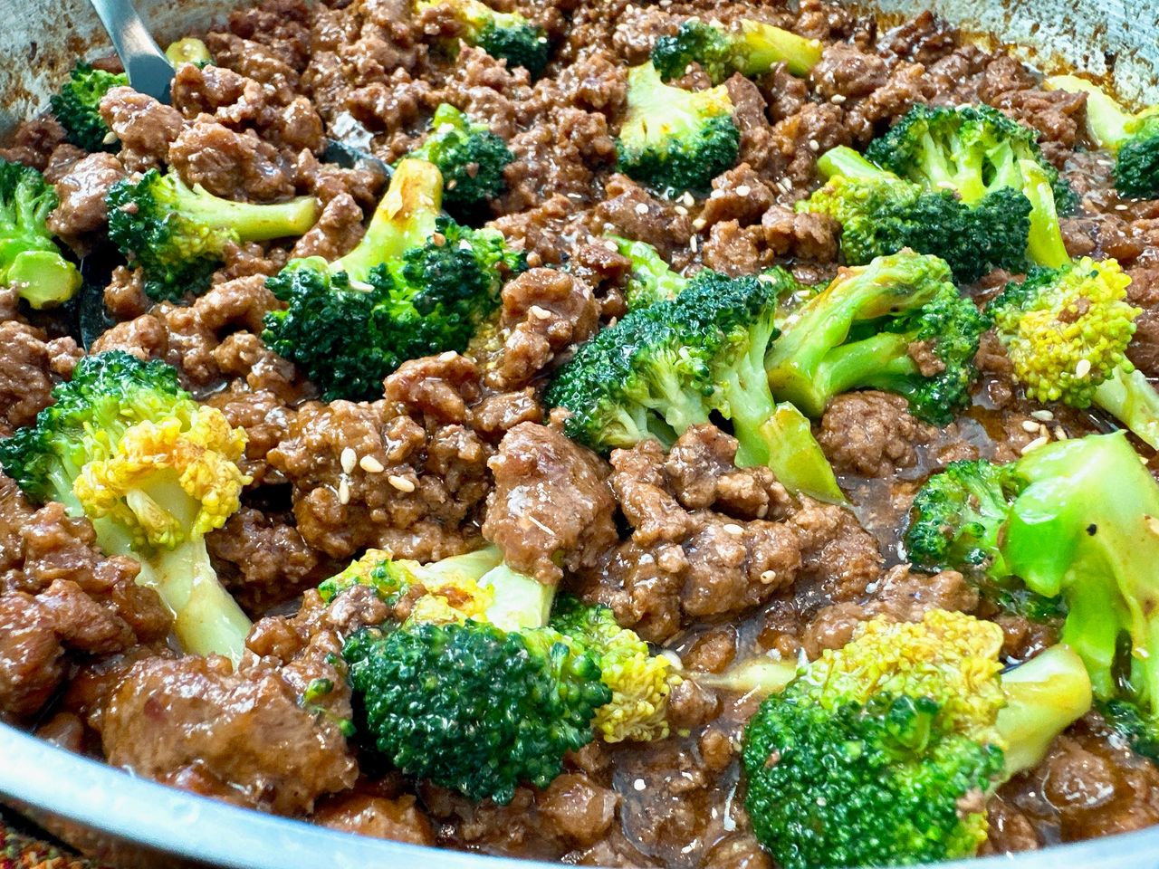 beef and broccoli in a skillet