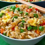 Fried rice in a bowl with chopsticks